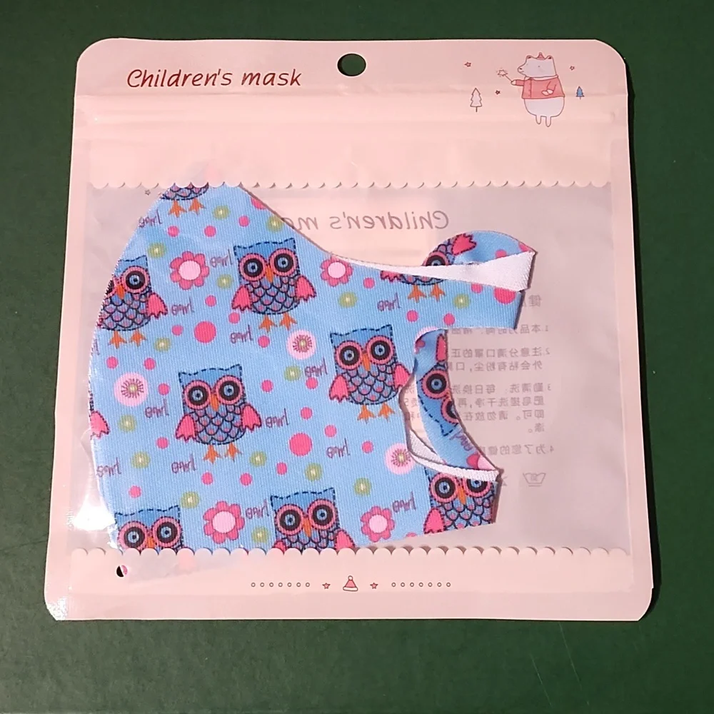 Children's re Usable face mask new in package never opened